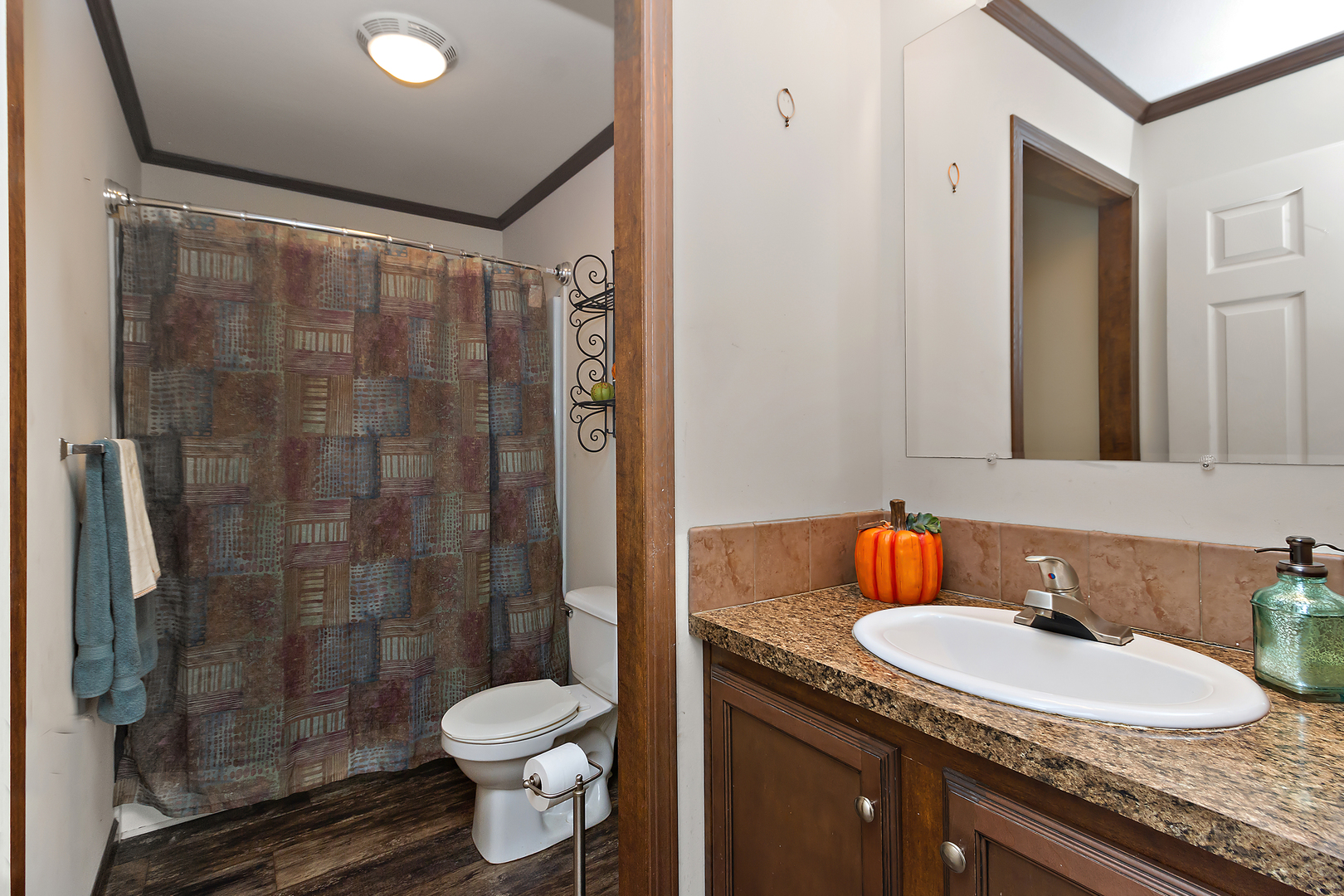 17 St Paul Bourbonnais, IL 60914 - Photo 14 of 16 a bathroom with a granite countertop sink toilet and shower