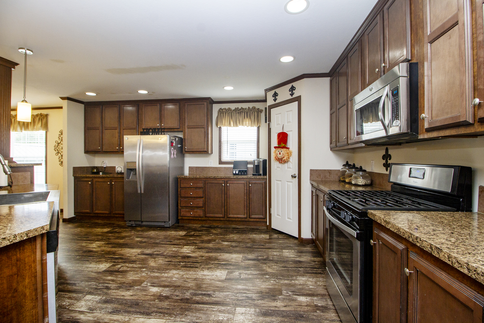 17 St Paul Bourbonnais, IL 60914 - Photo 3 of 16 a kitchen with stainless steel appliances granite countertop a refrigerator a stove and a sink
