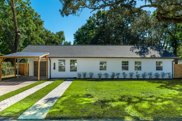 a front view of house with yard and green space