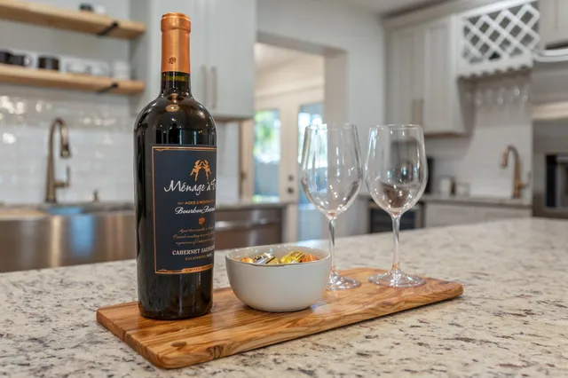 a bedroom with a bed tv and a window