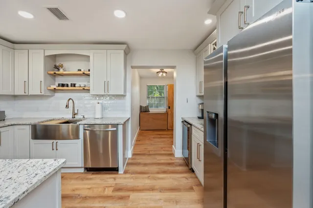 a bathroom with a toilet and a shower curtain
