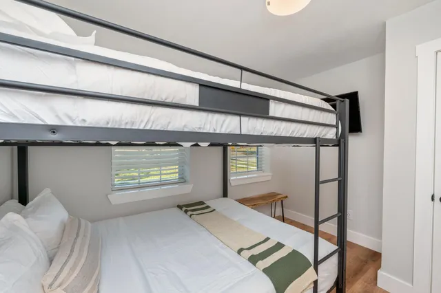 a balcony with furniture and wooden floor