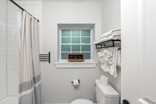 a view of a house with a backyard and swimming pool