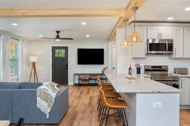 a view of a swimming pool with a yard