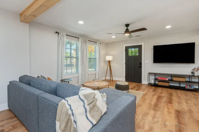 a kitchen with stainless steel appliances granite countertop a sink stove and microwave