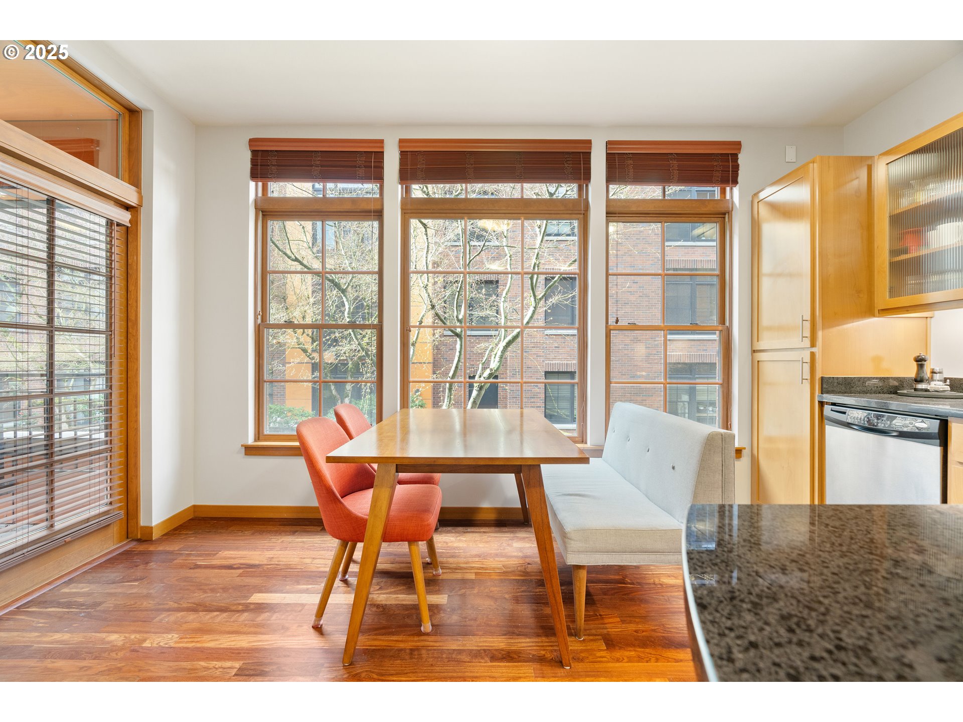 2350 Northwest Savier Street, Unit 202 Portland, OR 97210 - Photo 11 of 30 a dining room with furniture and large windows