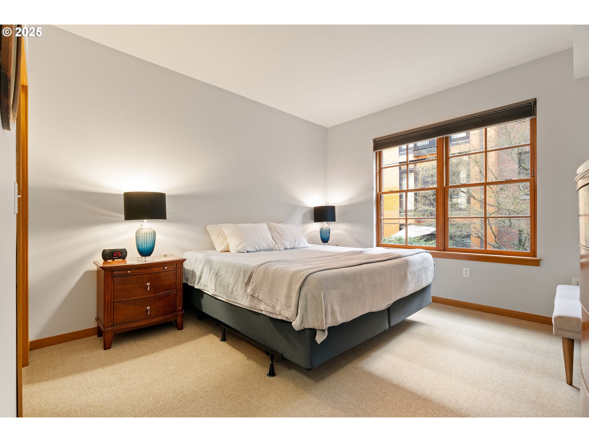 2350 Northwest Savier Street, Unit 202 Portland, OR 97210 - Photo 15 of 30 a spacious bedroom with a bed and window