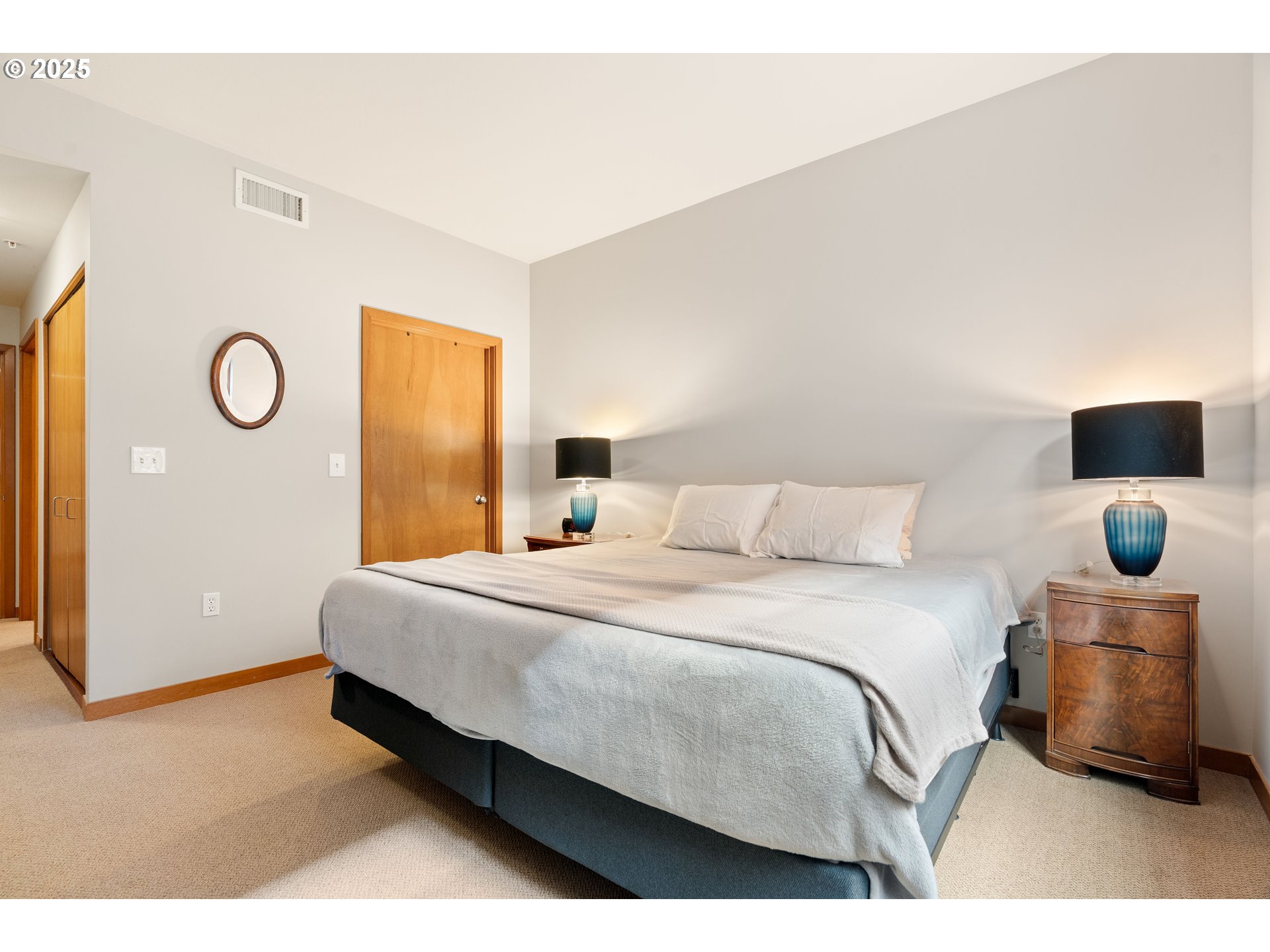 2350 Northwest Savier Street, Unit 202 Portland, OR 97210 - Photo 16 of 30 a bedroom with a bed and cabinets