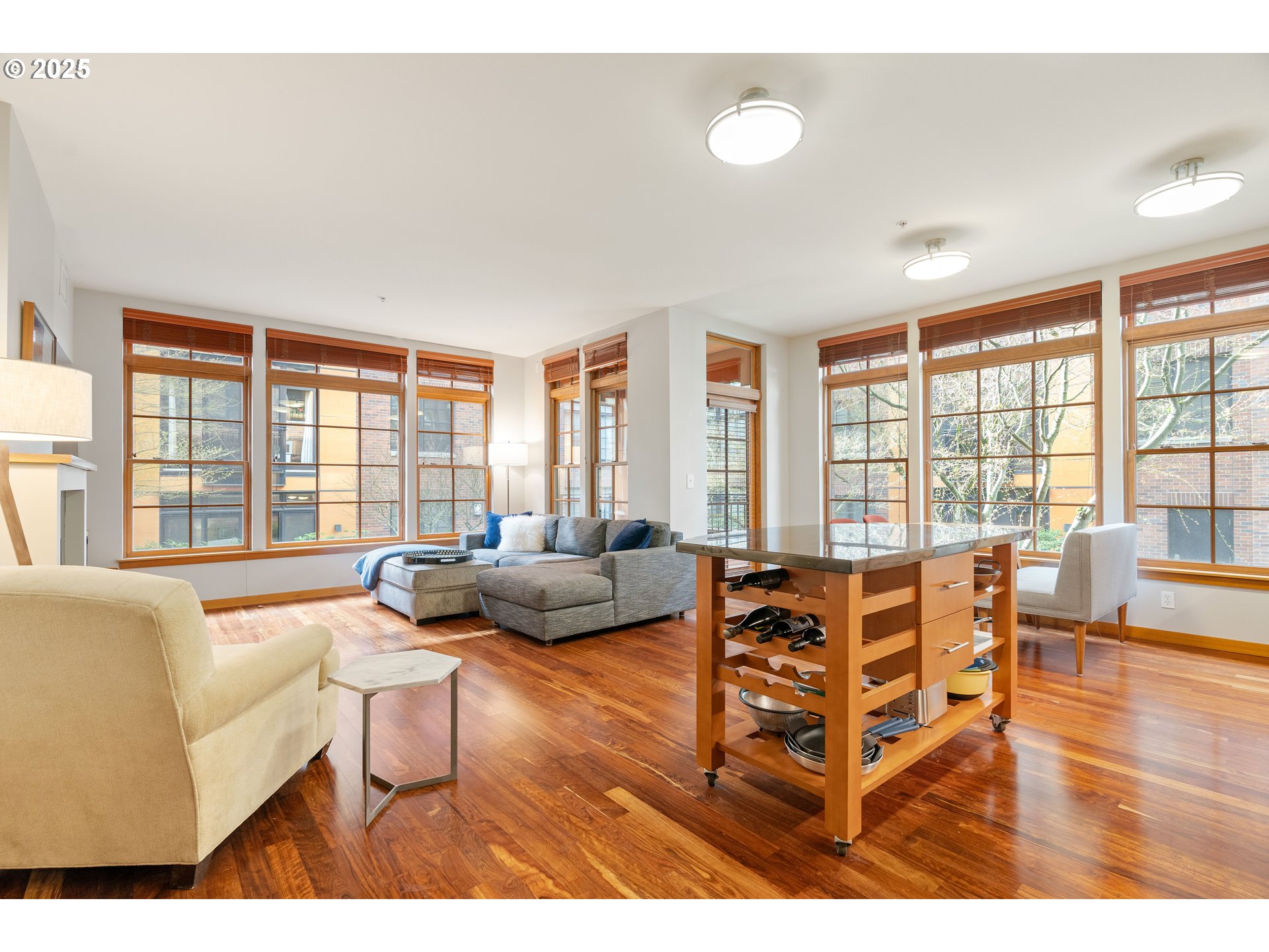 2350 Northwest Savier Street, Unit 202 Portland, OR 97210 - Photo 2 of 30 a living room with furniture and floor to ceiling windows