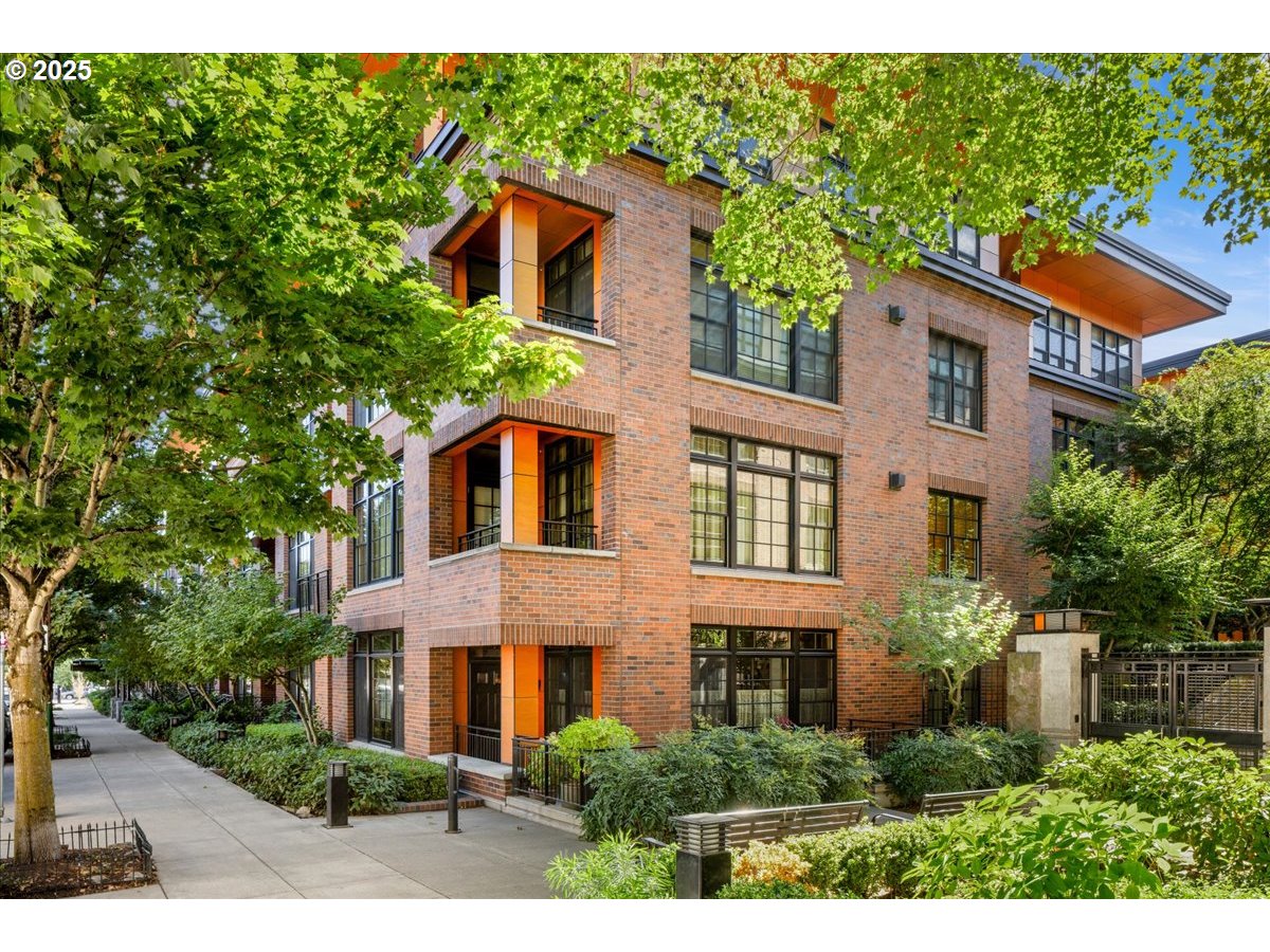 2350 Northwest Savier Street, Unit 202 Portland, OR 97210 - Photo 28 of 30 a front view of a house with a yard