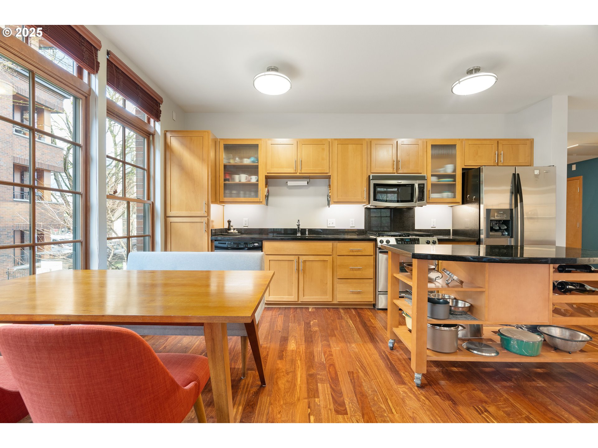 2350 Northwest Savier Street, Unit 202 Portland, OR 97210 - Photo 8 of 30 a kitchen with stainless steel appliances granite countertop a sink and cabinets
