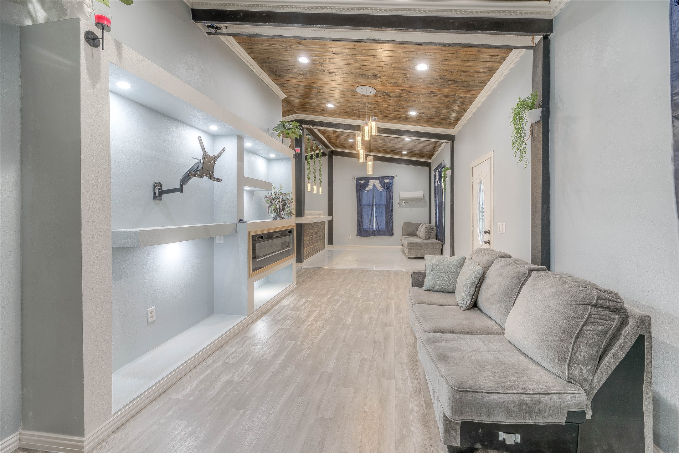 228 1 Such Road Livingston, TX 77351 - Photo 11 of 35 a living room with furniture and a chandelier