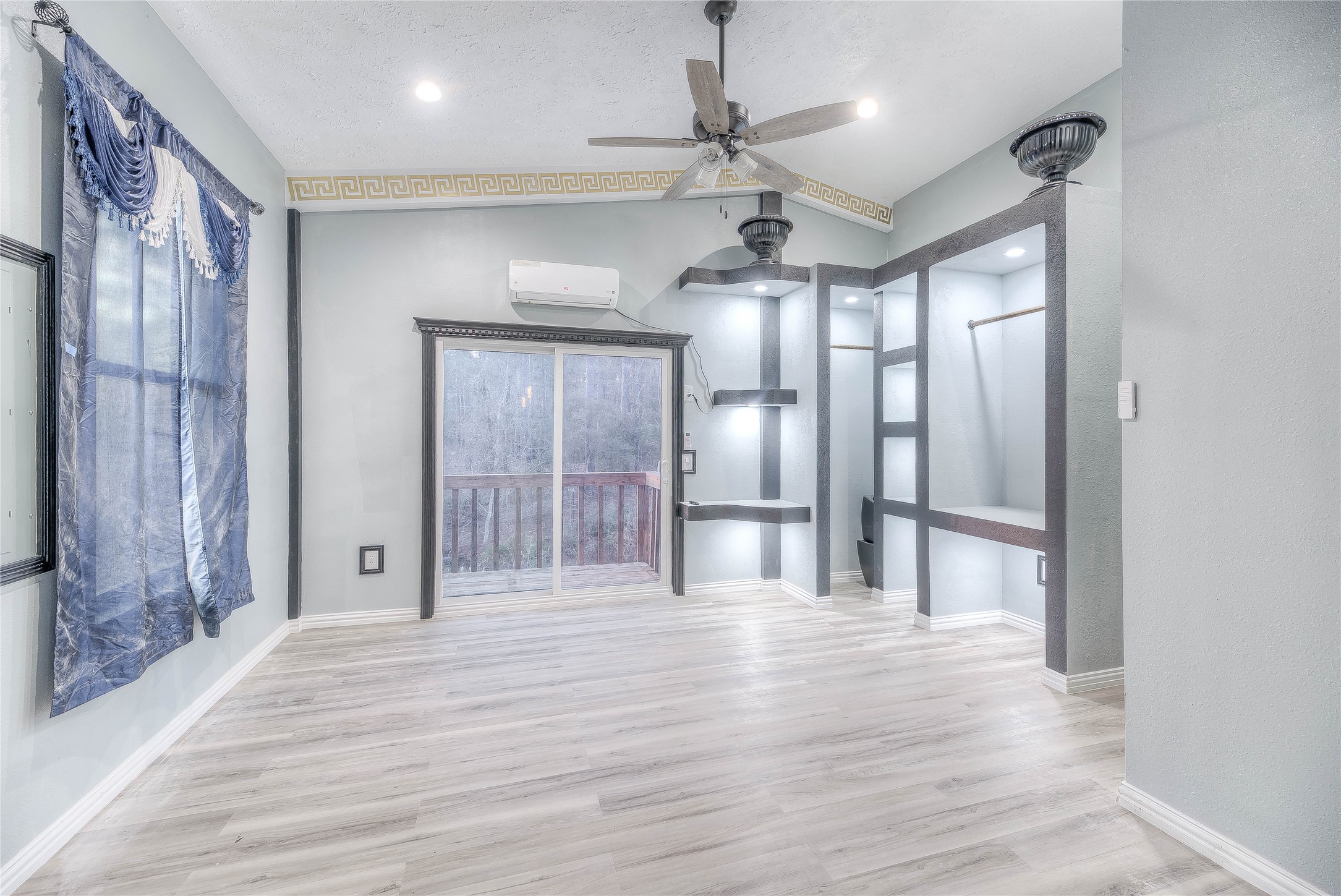 228 1 Such Road Livingston, TX 77351 - Photo 14 of 35 a view of an empty room with wooden floor and a window