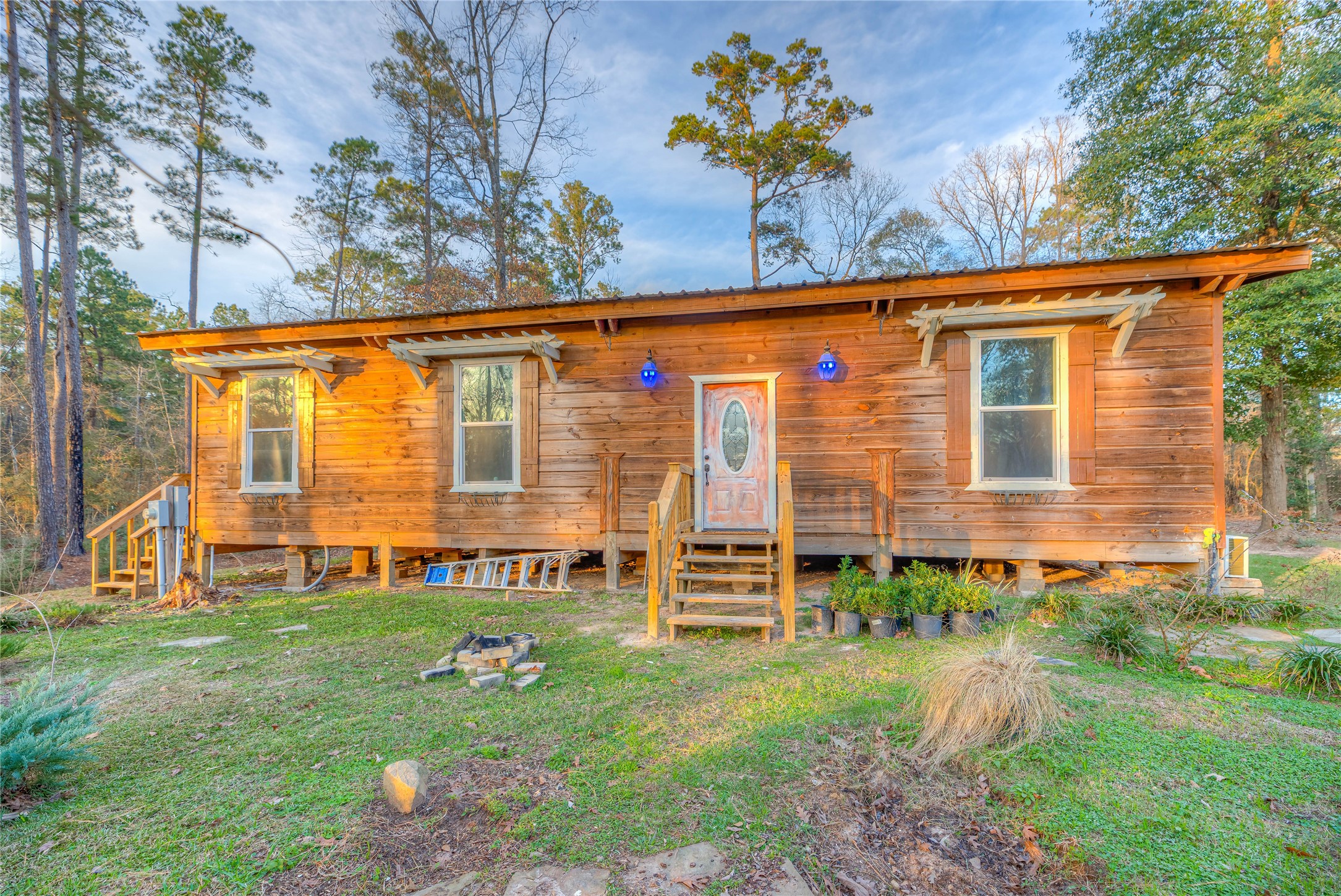 228 1 Such Road Livingston, TX 77351 - Photo 18 of 35 a front view of a house with garden