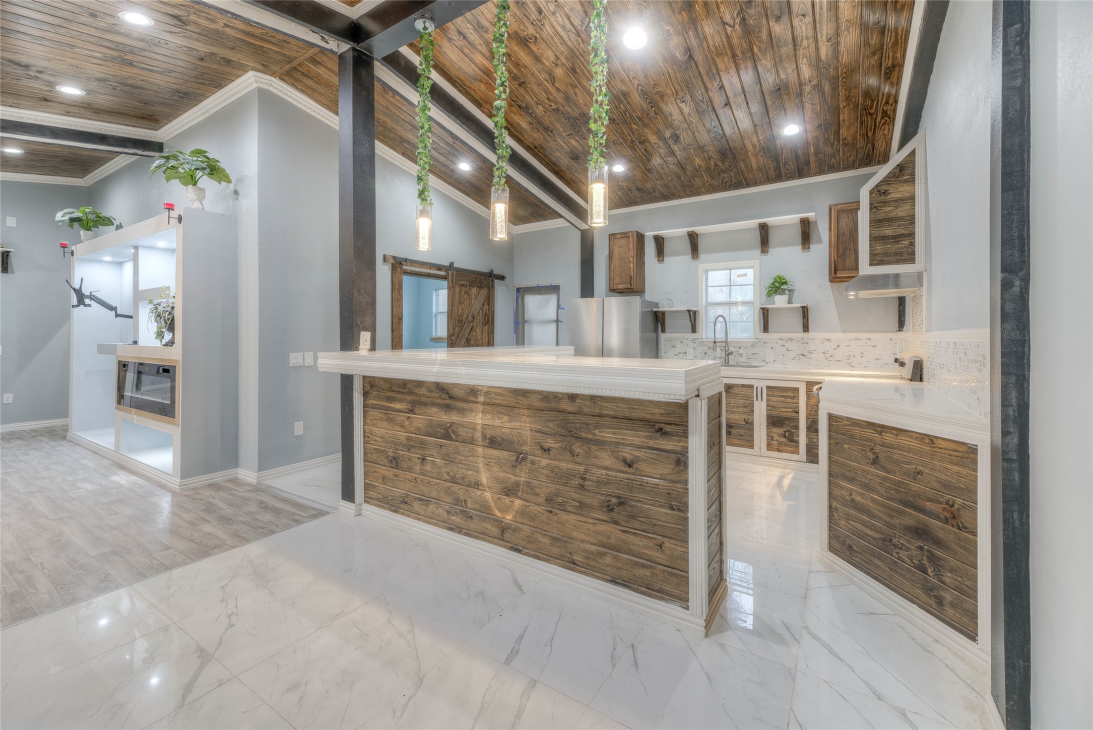 228 1 Such Road Livingston, TX 77351 - Photo 5 of 35 a view of a hallway with wooden cabinets and stairs