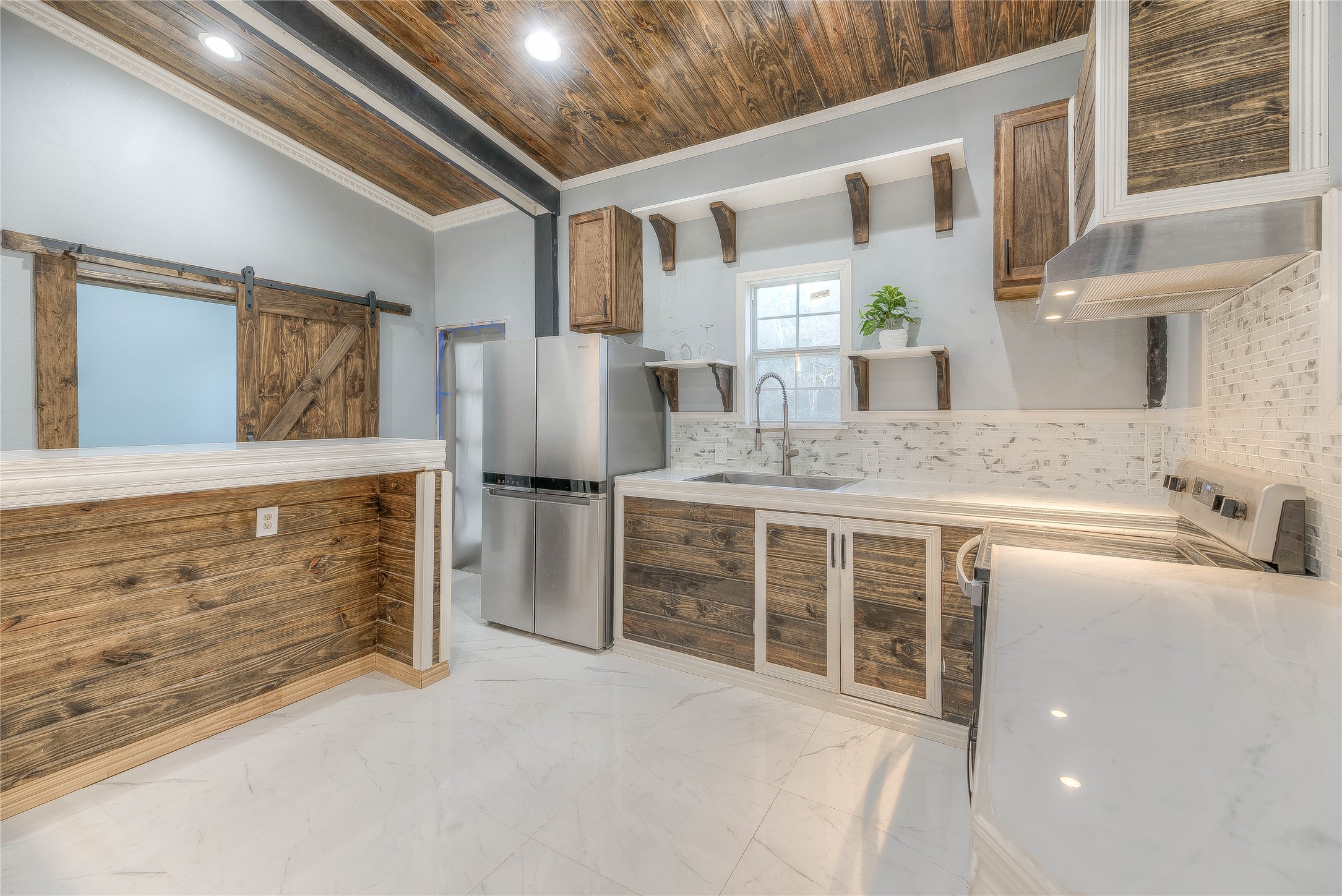 228 1 Such Road Livingston, TX 77351 - Photo 6 of 35 a kitchen with stainless steel appliances granite countertop a refrigerator and a sink