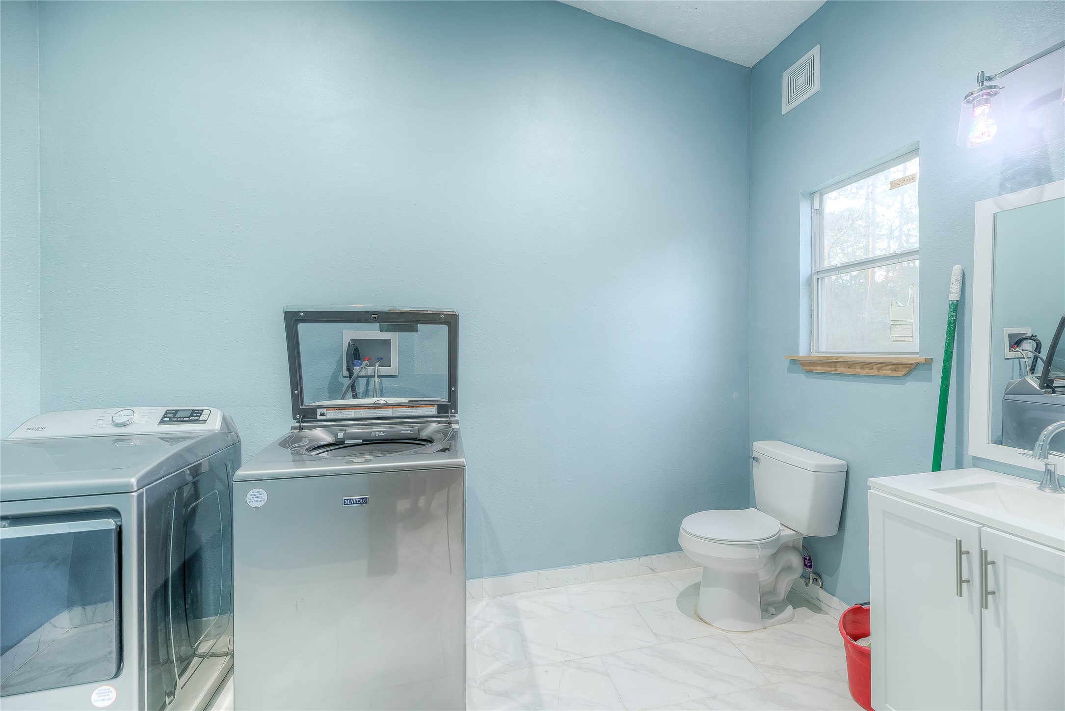 228 1 Such Road Livingston, TX 77351 - Photo 9 of 35 a bathroom with a sink toilet and mirror