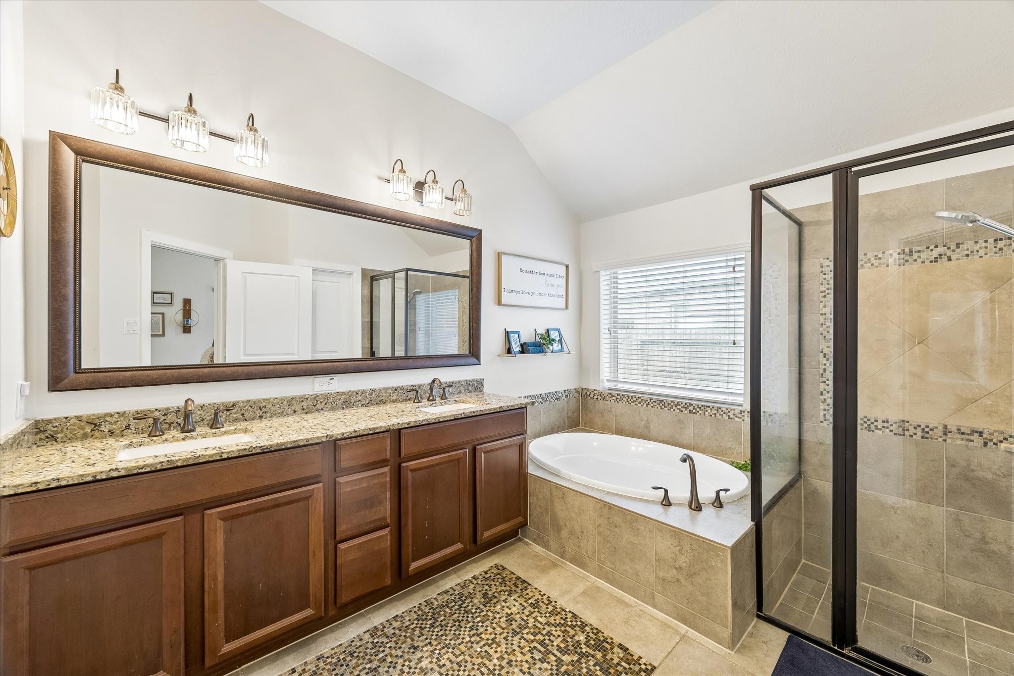 31306 Brighton Brook Lane Spring, TX 77386 - Photo 19 of 34 Spa-inspired primary bath showcasing dual vanities, granite countertops, a soaking tub, and an oversized walk-in shower.
