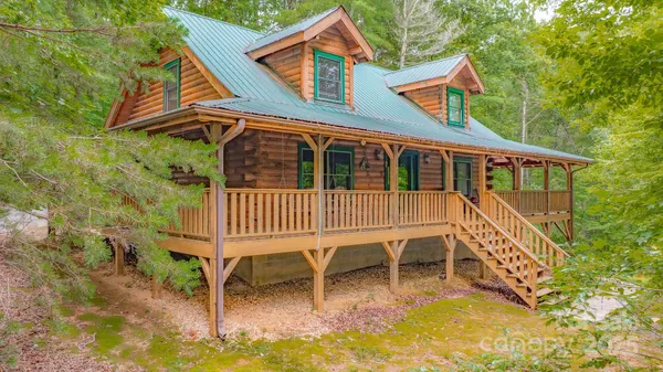a balcony with table and chairs
