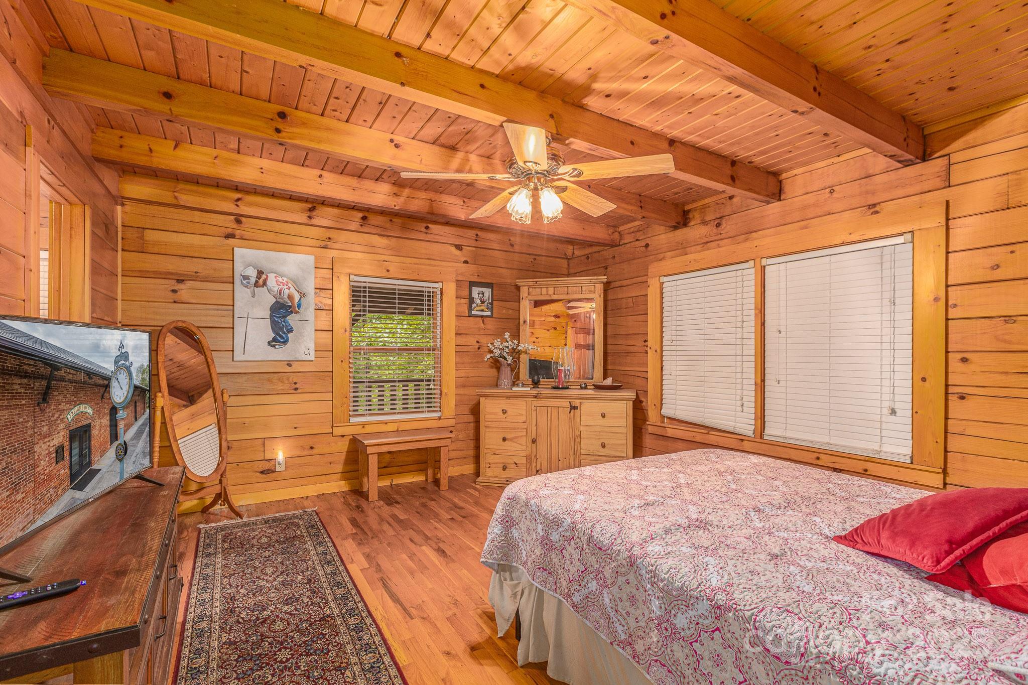 8331 Sugar Hill Road Marion, NC 28752 - Photo 12 of 36 a bed room with a bed and a television