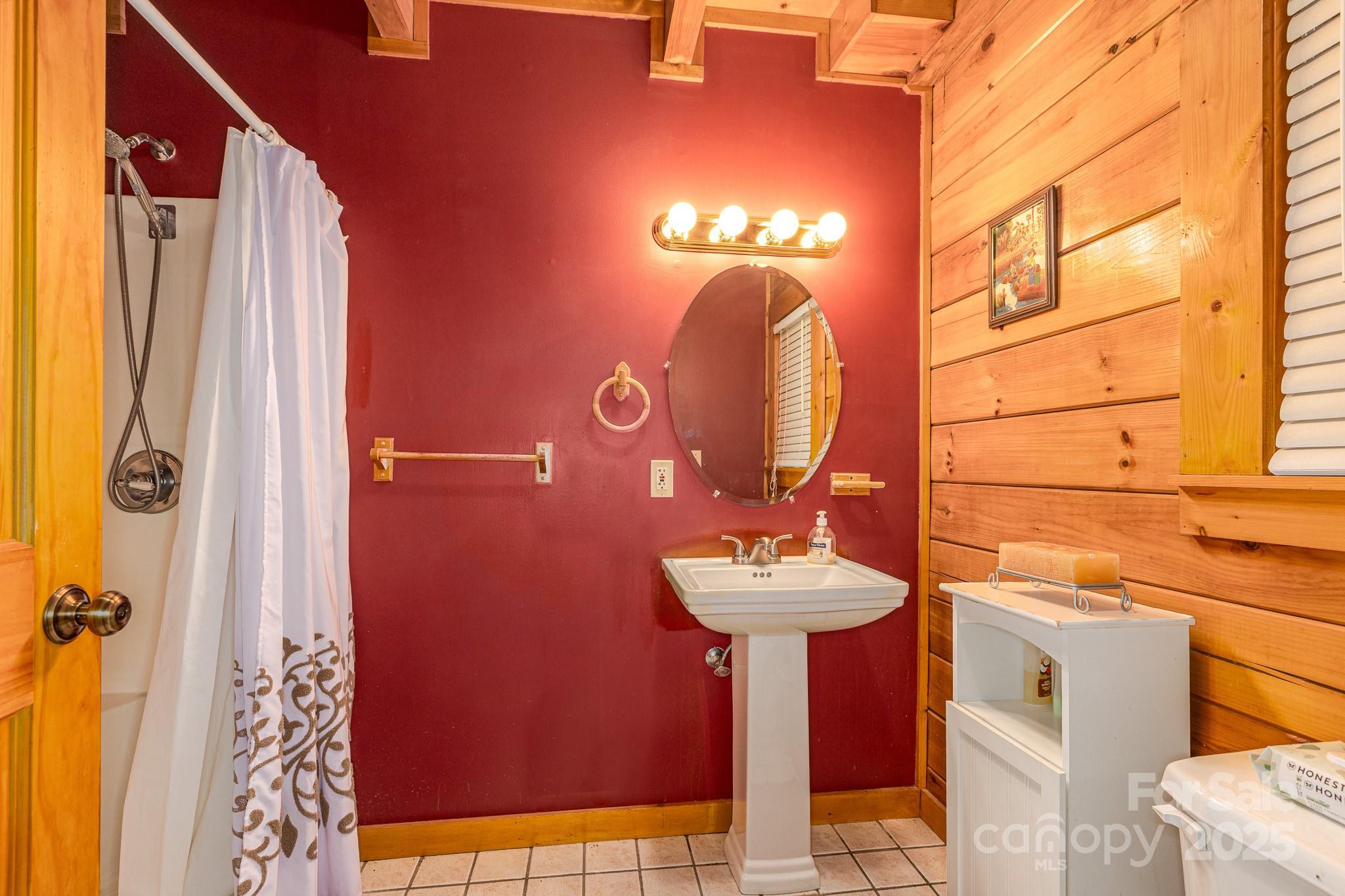 8331 Sugar Hill Road Marion, NC 28752 - Photo 13 of 36 a bathroom with a sink shower and a mirror