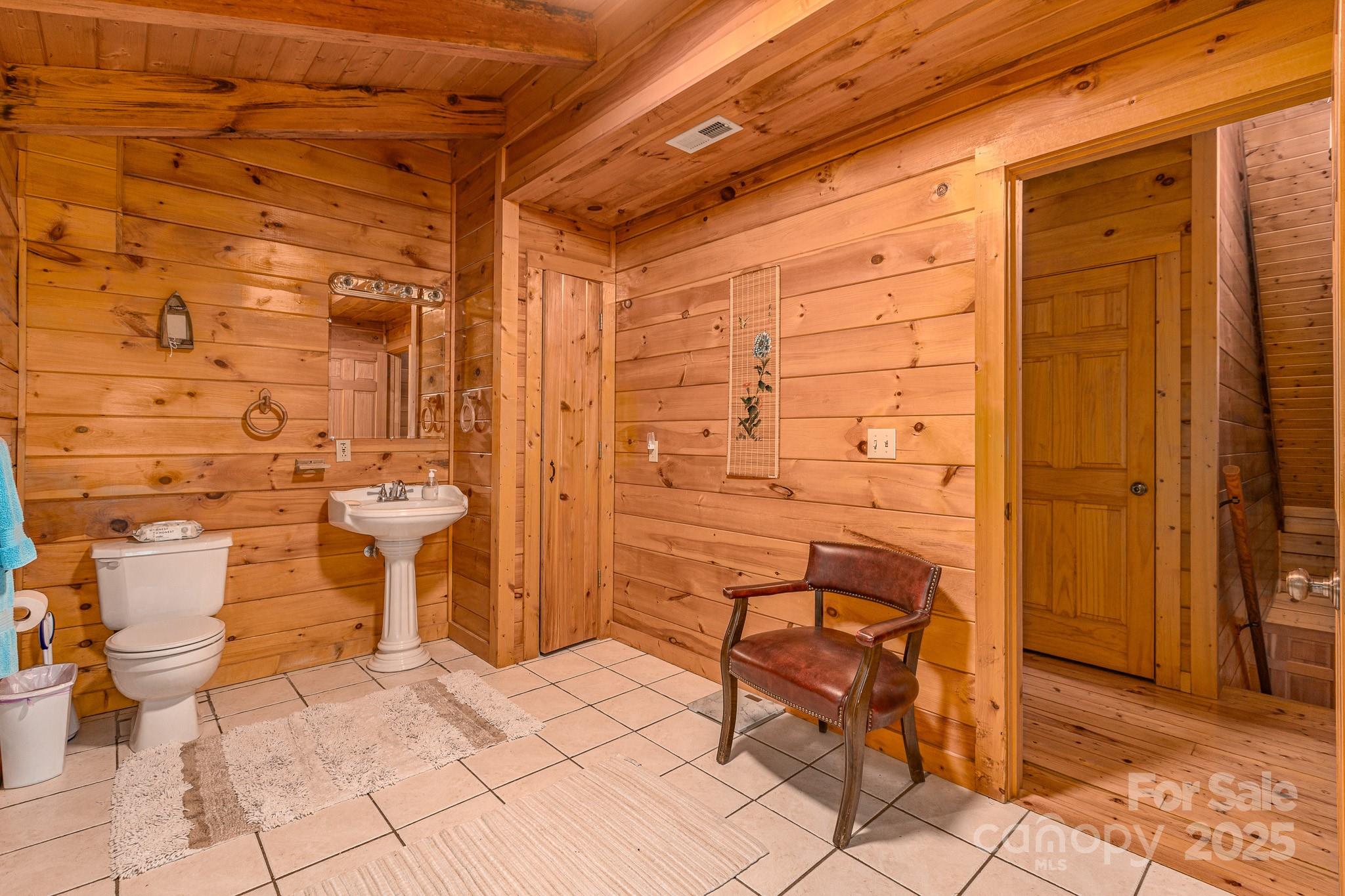 8331 Sugar Hill Road Marion, NC 28752 - Photo 16 of 36 a bathroom with a toilet and a shower