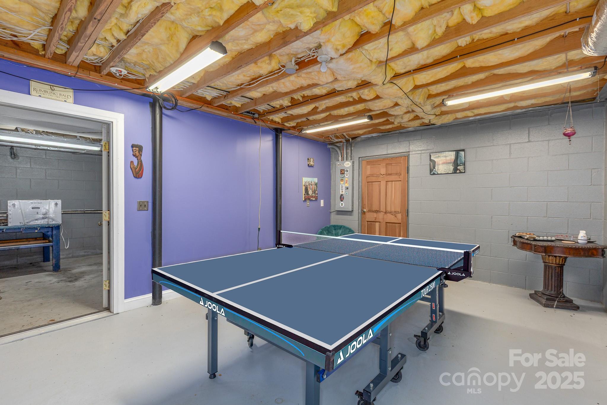 8331 Sugar Hill Road Marion, NC 28752 - Photo 17 of 36 a room with pool table and a chandelier