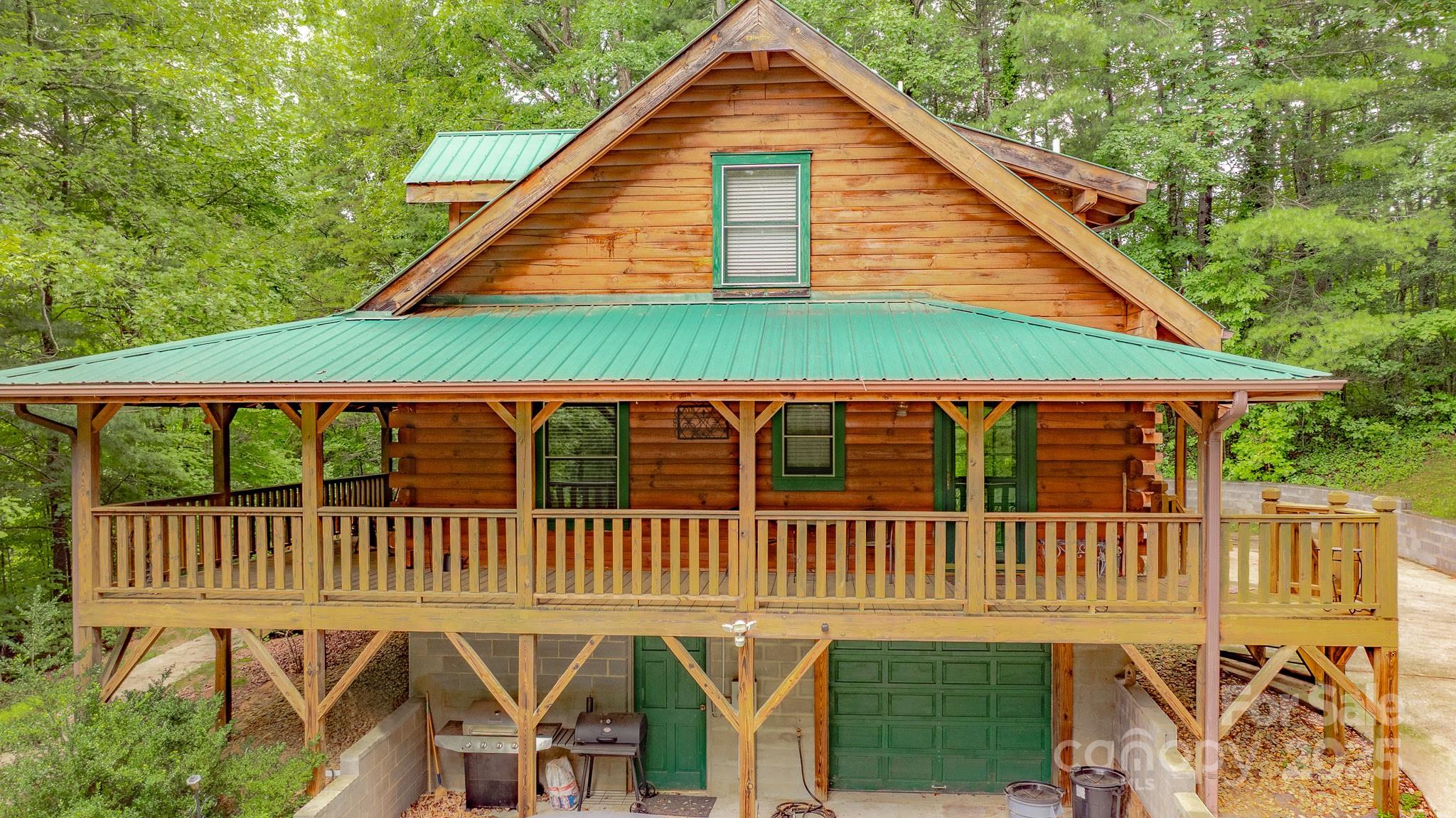 8331 Sugar Hill Road Marion, NC 28752 - Photo 2 of 36 a view of a house with a deck