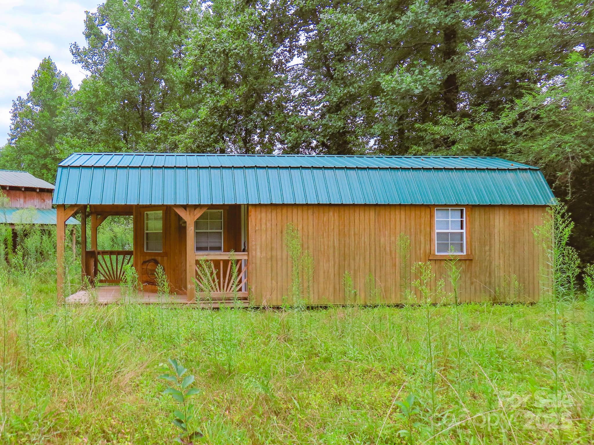 8331 Sugar Hill Road Marion, NC 28752 - Photo 26 of 36 a view of outdoor space with deck and backyard