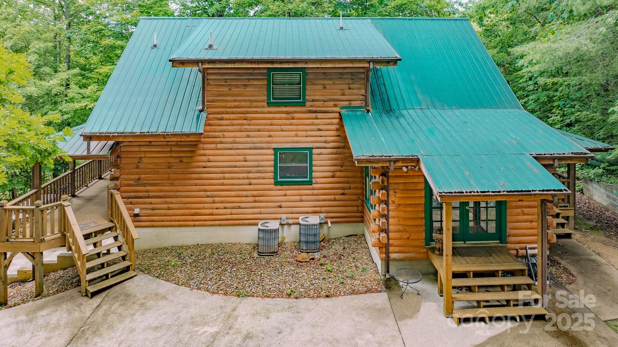 8331 Sugar Hill Road Marion, NC 28752 - Photo 3 of 36 a front view of a house with garden