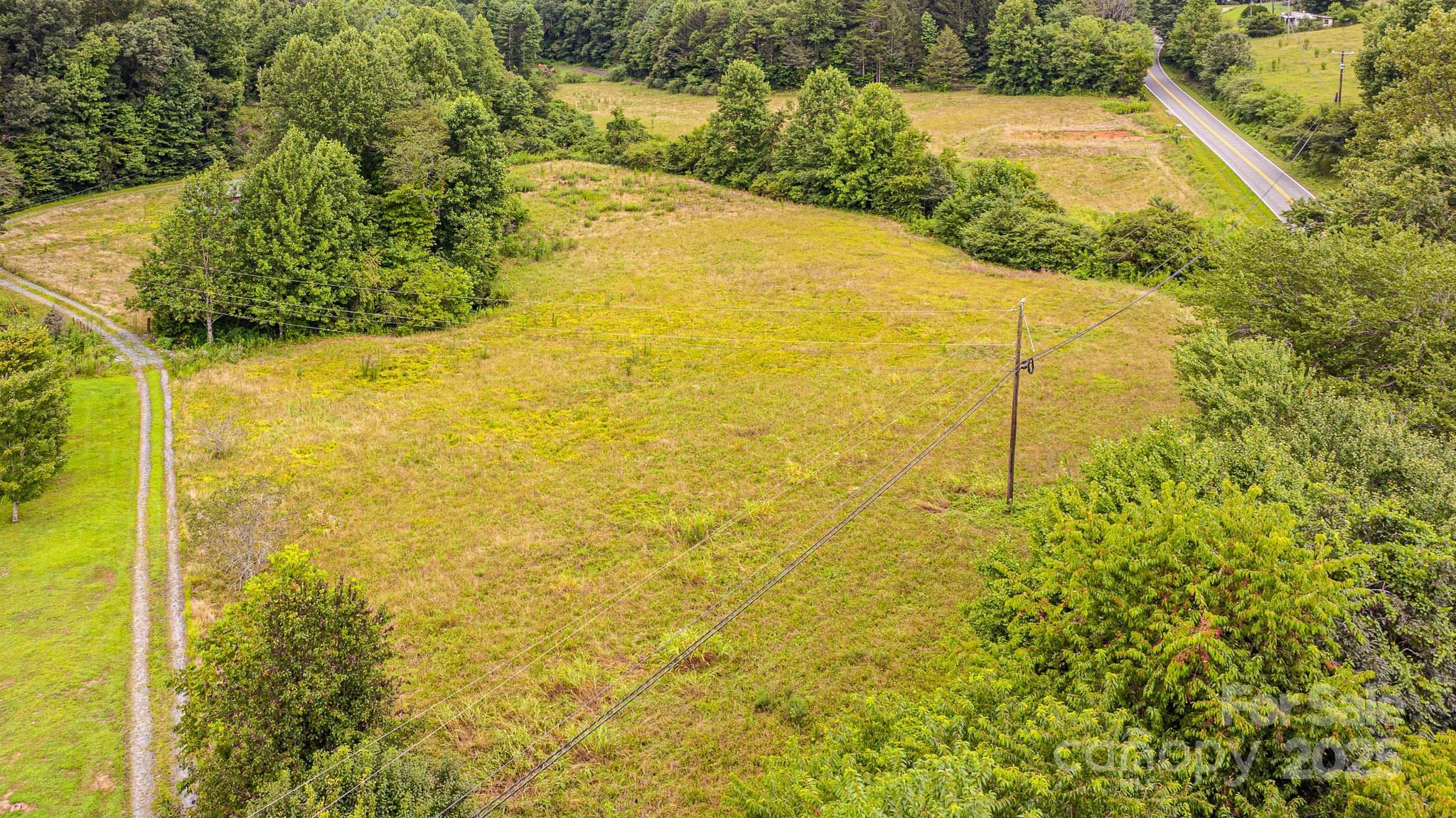 8331 Sugar Hill Road Marion, NC 28752 - Photo 31 of 36 a view of a swimming pool from a yard