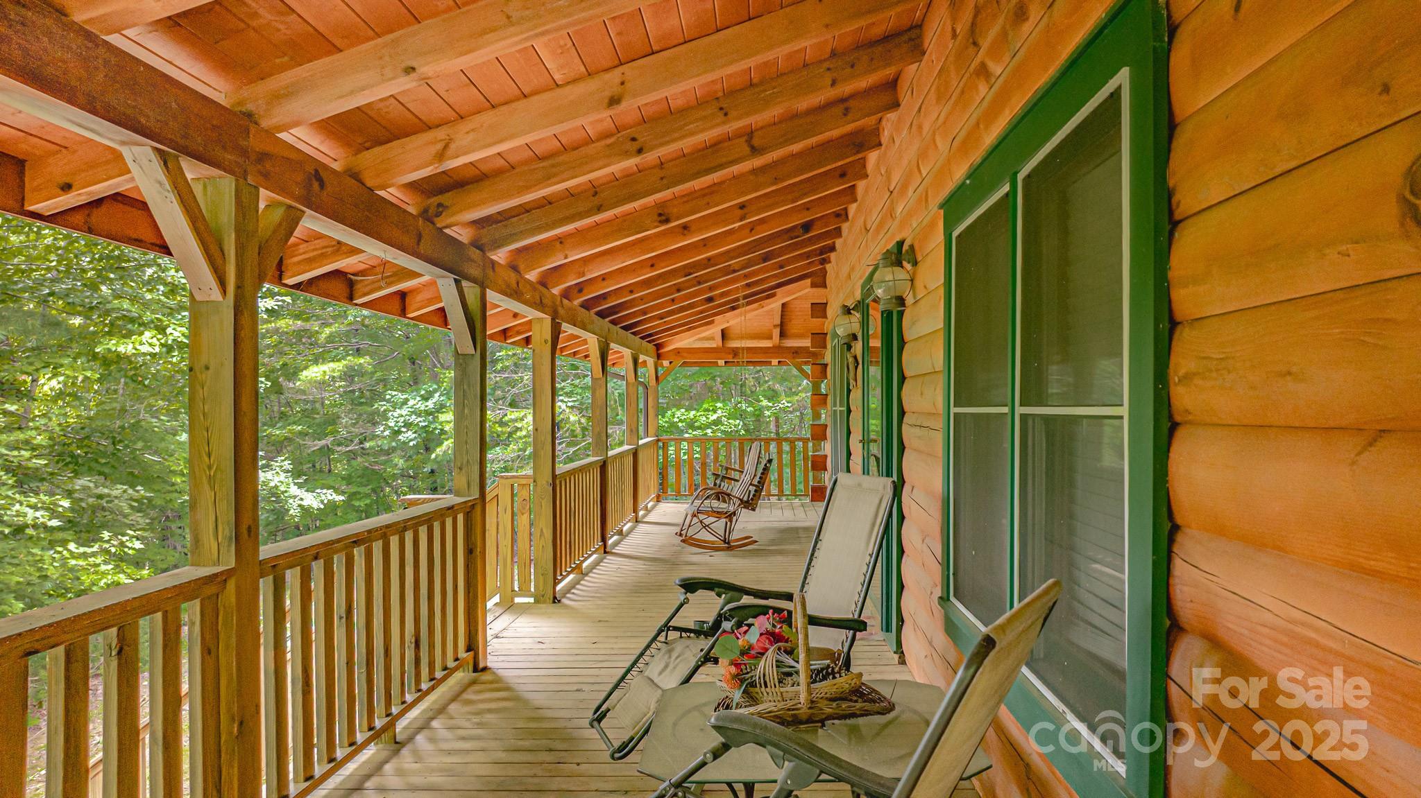8331 Sugar Hill Road Marion, NC 28752 - Photo 4 of 36 a view of balcony with couch and wooden floor