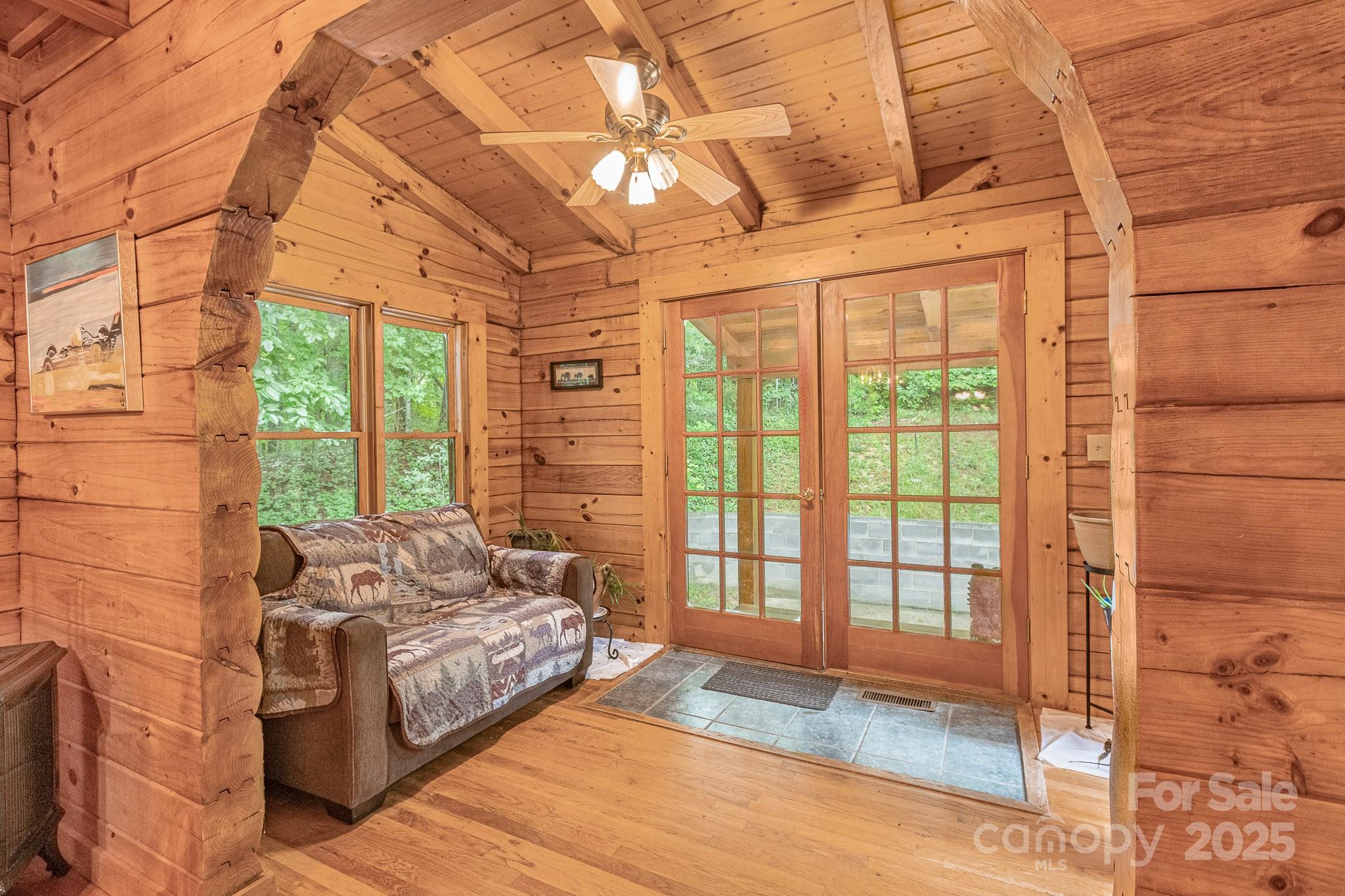 8331 Sugar Hill Road Marion, NC 28752 - Photo 5 of 36 a bedroom with a bed and wooden floor