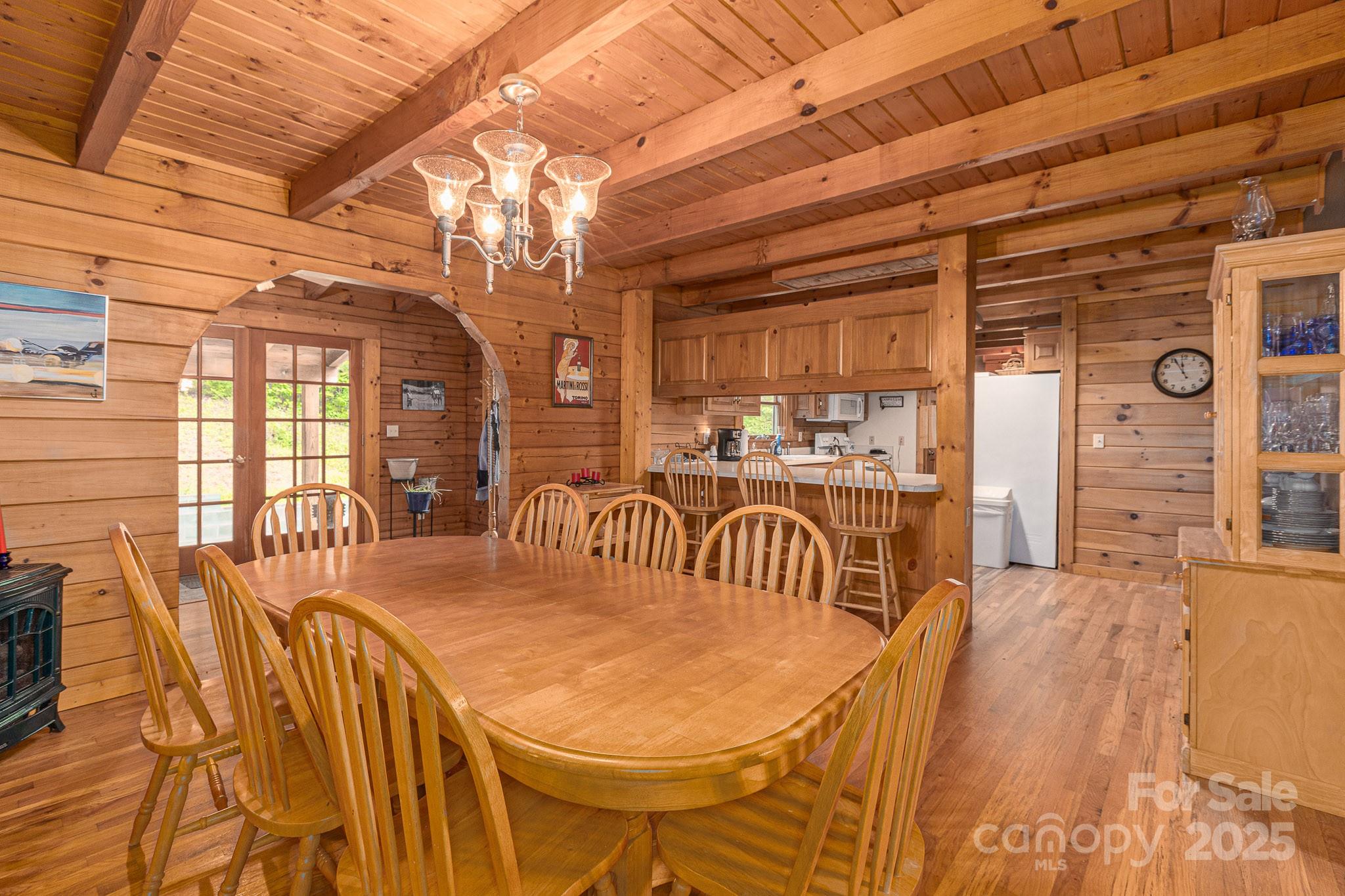 8331 Sugar Hill Road Marion, NC 28752 - Photo 7 of 36 a view of a dining room with furniture and a chandelier