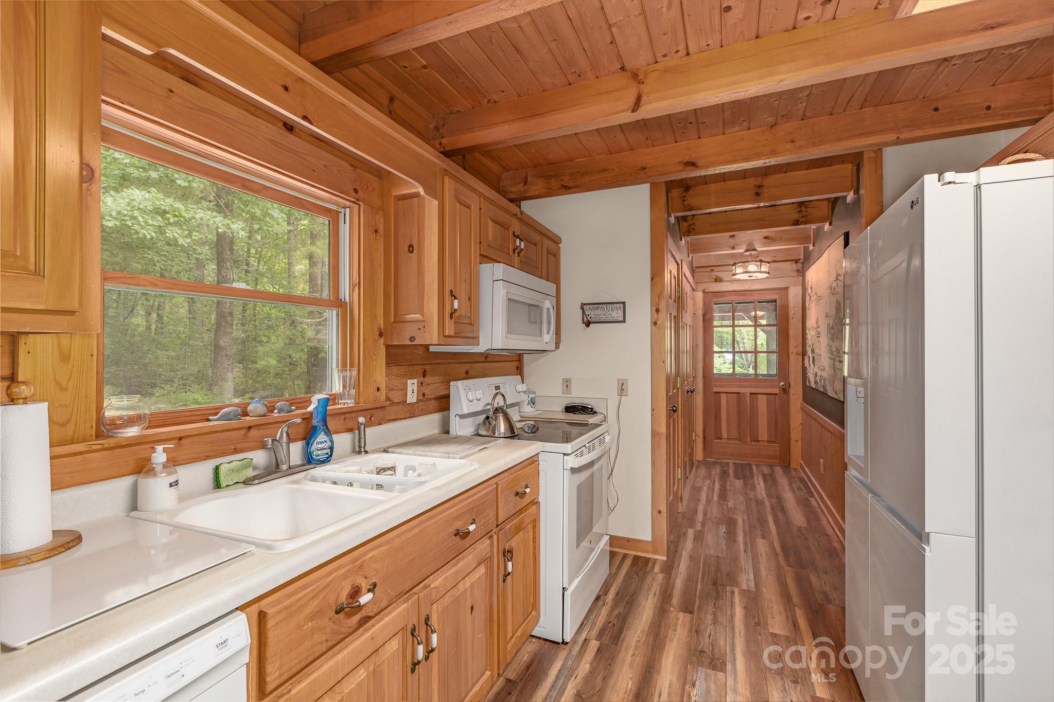 8331 Sugar Hill Road Marion, NC 28752 - Photo 8 of 36 a bathroom with a sink and a large mirror