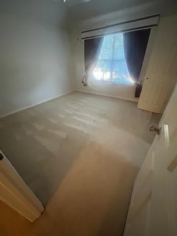 a bathroom with a glass door shower