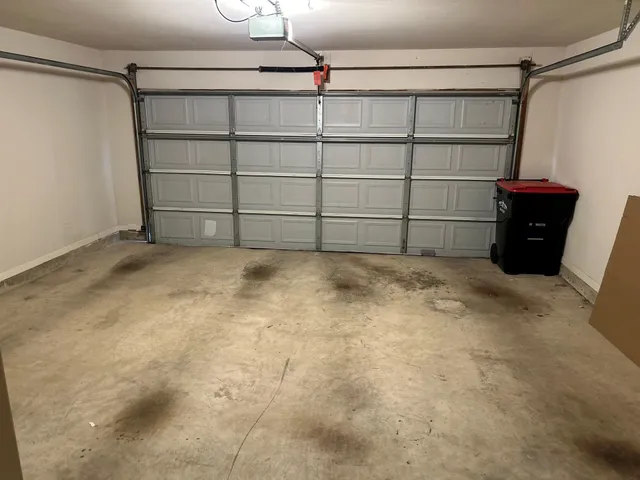 a room with window and a chair