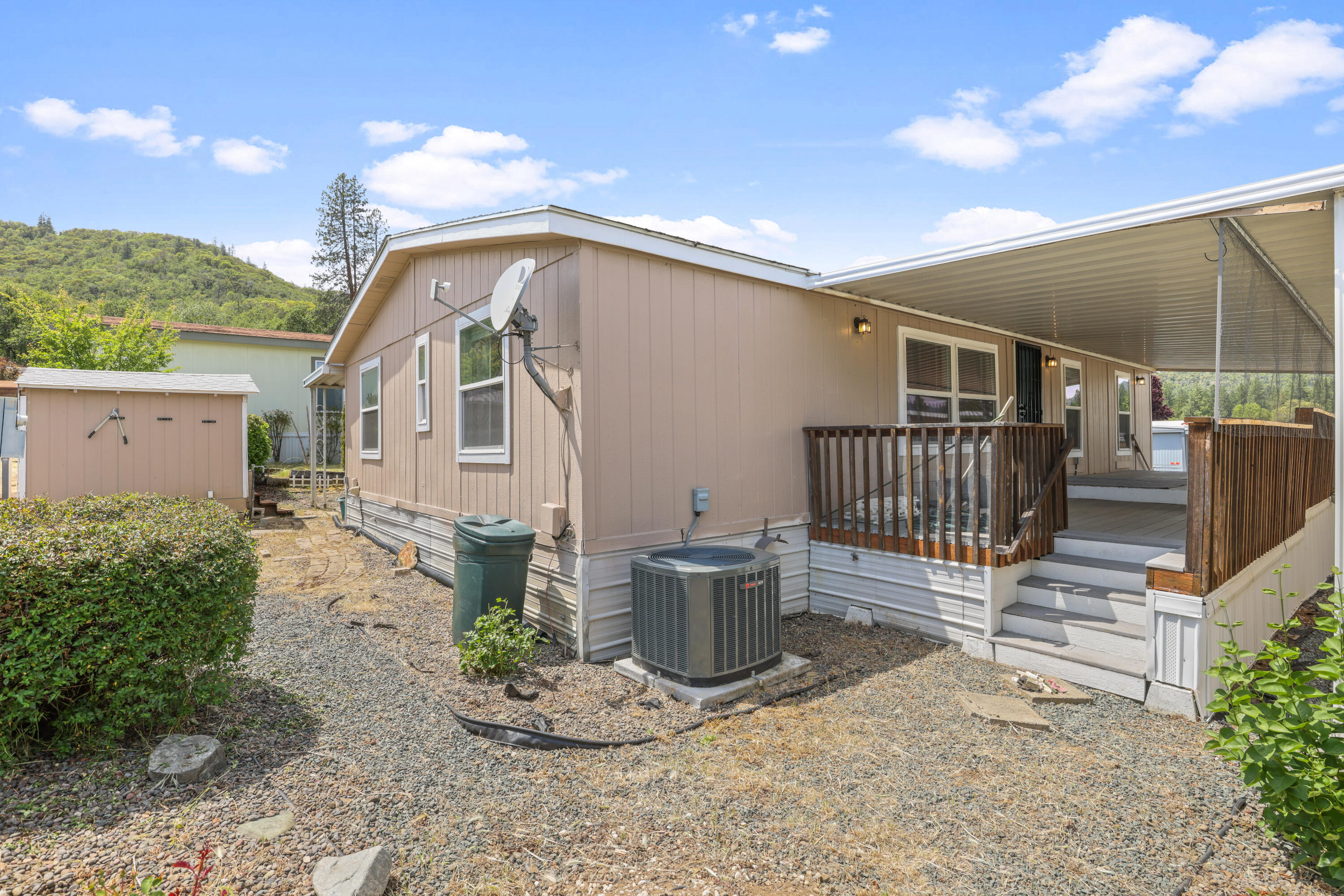 8401 Old Stage Road, Unit 16 Central Point, OR 97502 - Photo 3 of 23 a front view of a house with garden