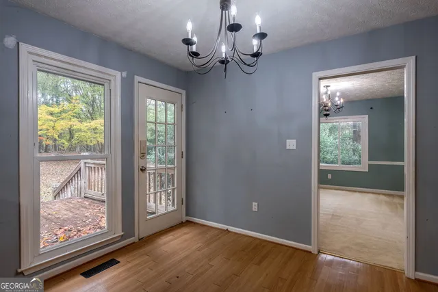 a view of a livingroom with a ceiling fan and window
