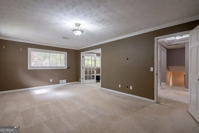 a bathroom with a granite countertop sink a toilet and a mirror