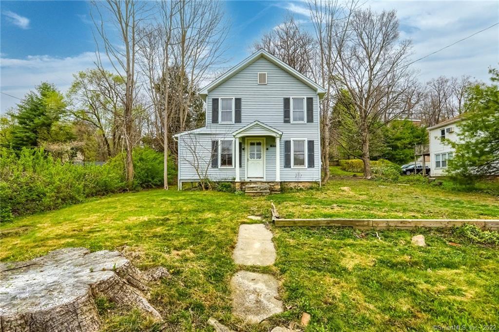 27 Poplar Street New Milford, CT 06776 - Photo 1 of 1 a front view of a house with a yard