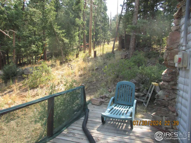 a view of balcony with two chairs and a table