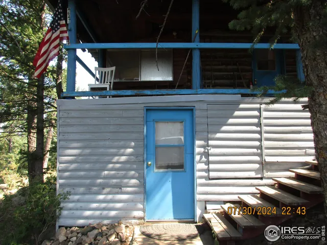 a view of a house with a door and a balcony