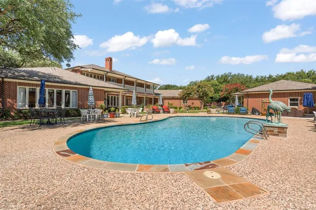 a view of a park with large trees