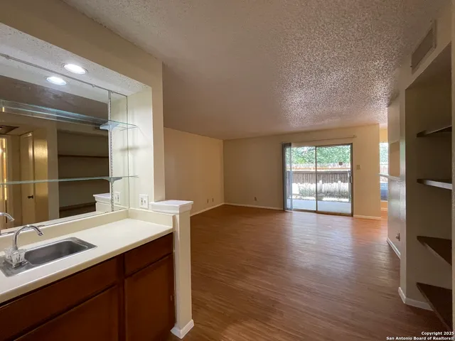 a bathroom with a sink double vanity and a mirror