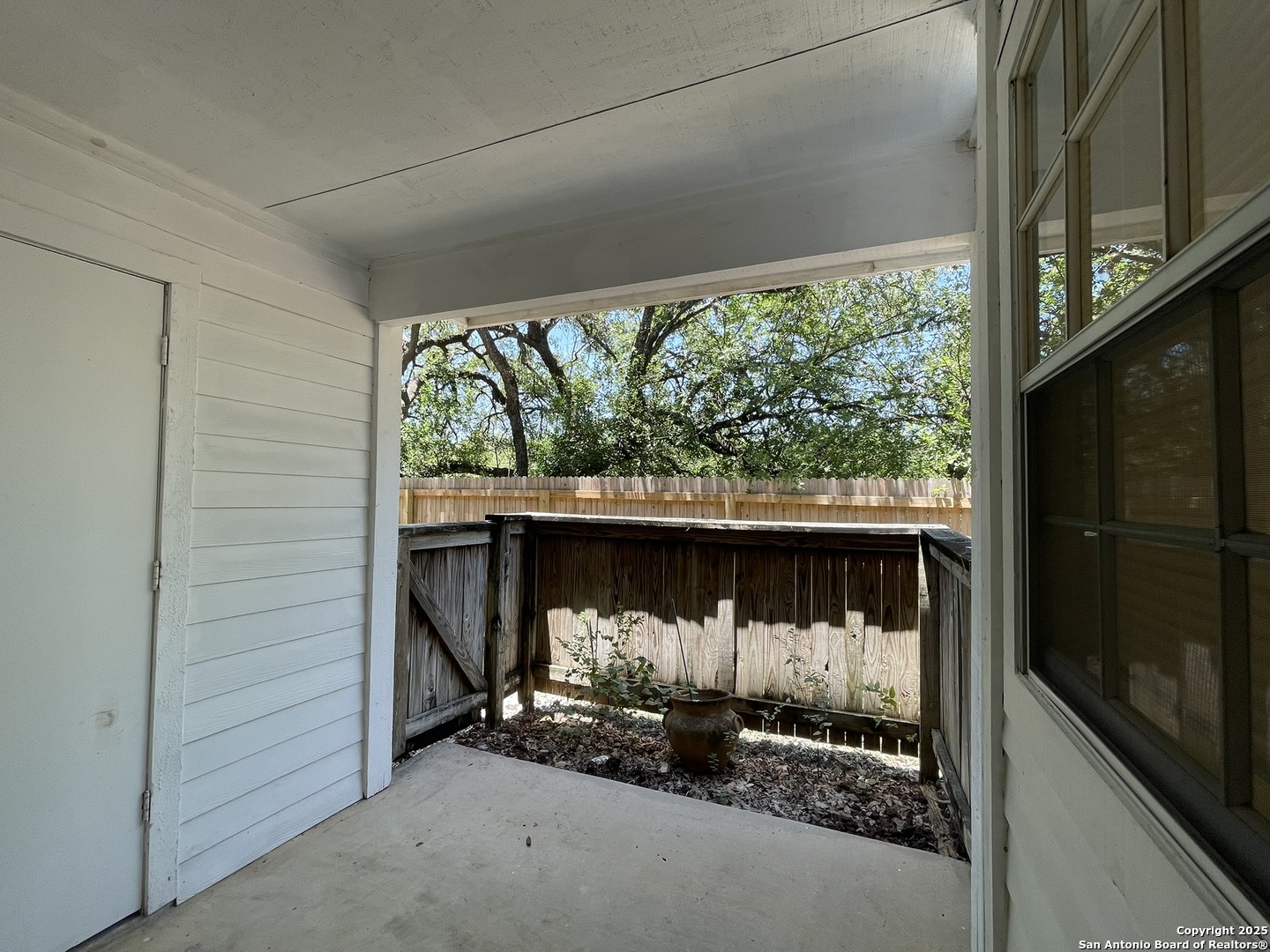 11311 Sir Winston Street, Unit 604 San Antonio, TX 78216 - Photo 20 of 24 a view of a porch with a fireplace