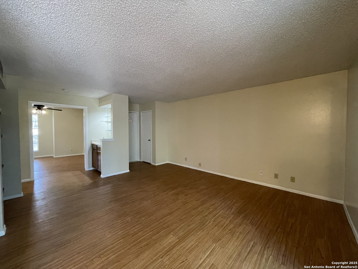 11311 Sir Winston Street, Unit 604 San Antonio, TX 78216 - Photo 7 of 24 a view of empty room with wooden floor