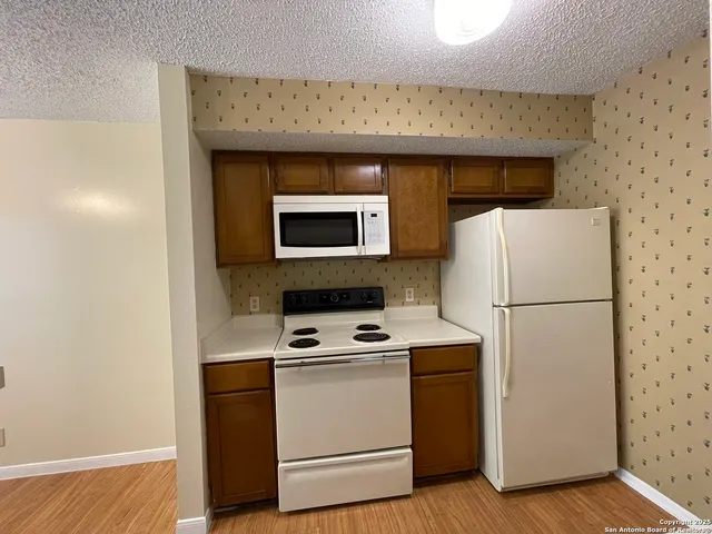 a utility room with washer and dryer