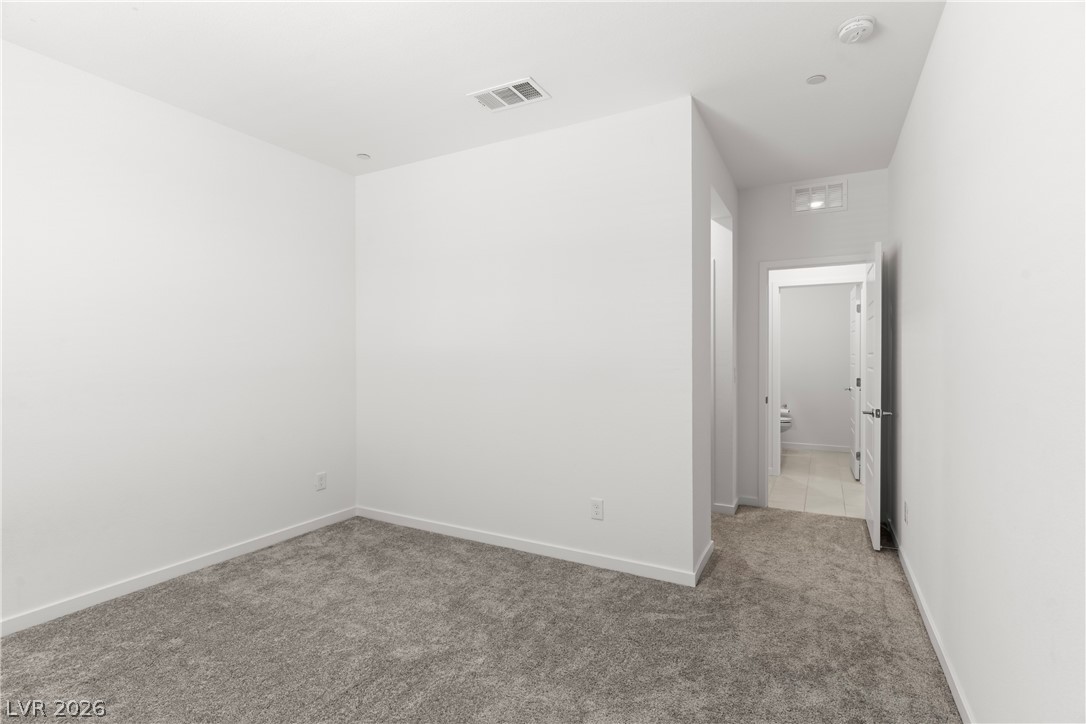 320 Isla Enclave Way Henderson, NV 89011 - Photo 8 of 49 This spacious, carpeted room offers a neutral palette, ready for personalization.