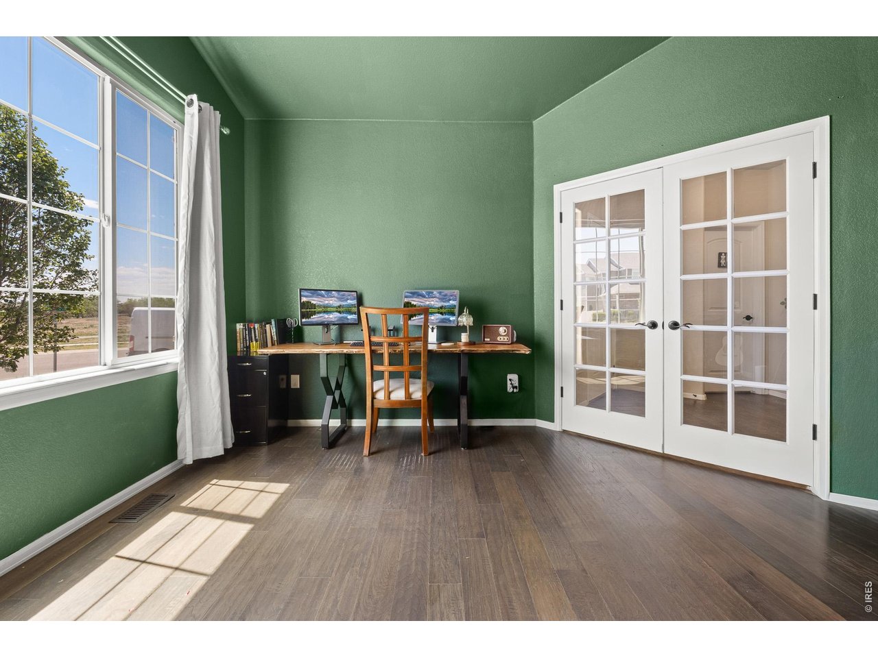 8847 16th St Road Greeley, CO 80634 - Photo 33 of 38 a view of a room with gym equipment and windows